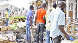 Traders picking their pieces after the recent bomb blast near the Shenekan Gate at the Maiduguri Monday Market
