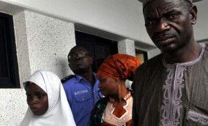 ABDUCTED GIRL — Freed Ese Oruru and an escort at Police Headquarters, Abuja, yesterday 